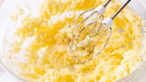 Bowl of light and fluffy creamed butter and sugar mixture, freshly blended with an electric mixer.