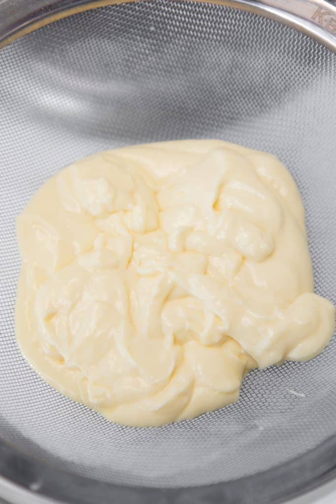 pastry cream in a sieve