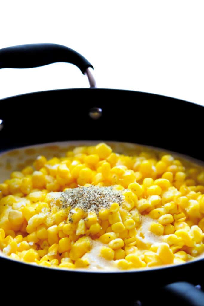 cream, corn and pepper in a pan