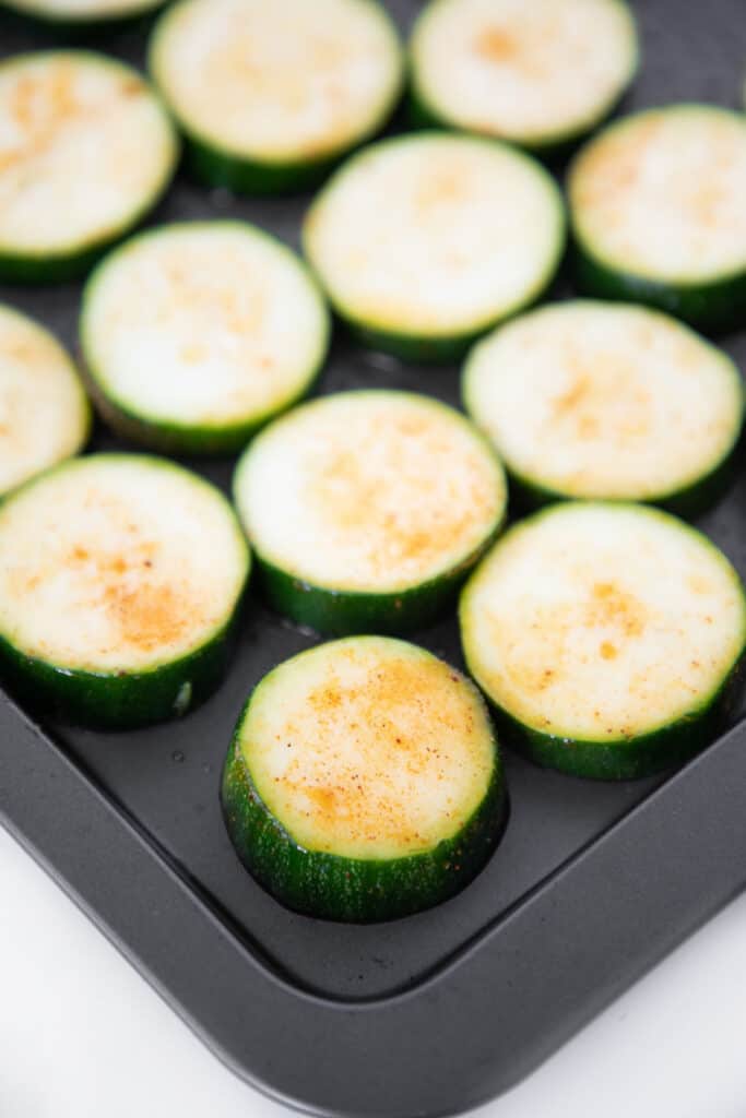 sliced zucchini on a baking sheet