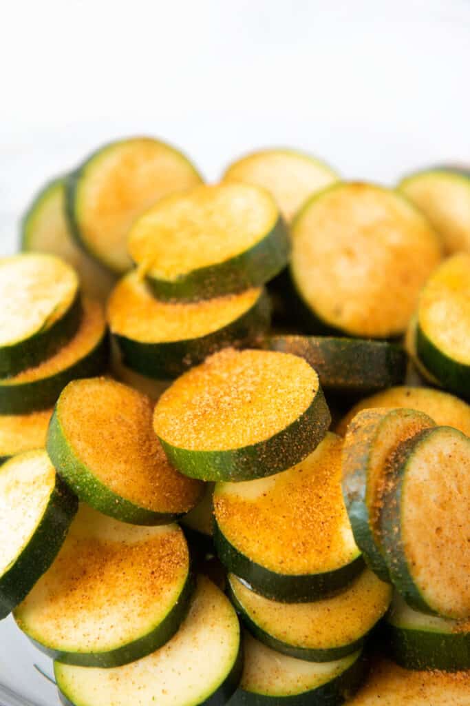 seasoned salt on sliced zucchini