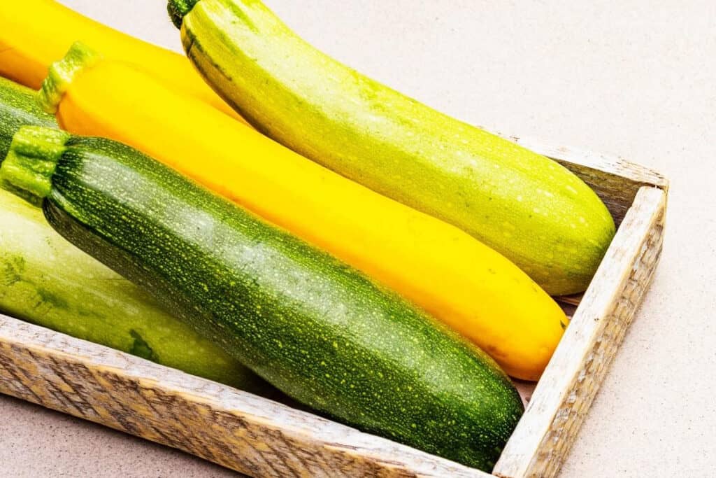 a box of yellow and green zucchini