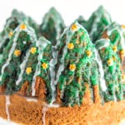 a bundt cake decorated with icing to look like Christmas trees