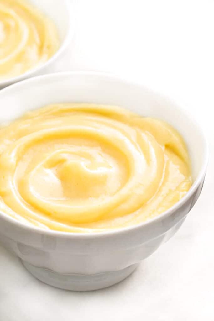 a white bowl filled with pastry cream