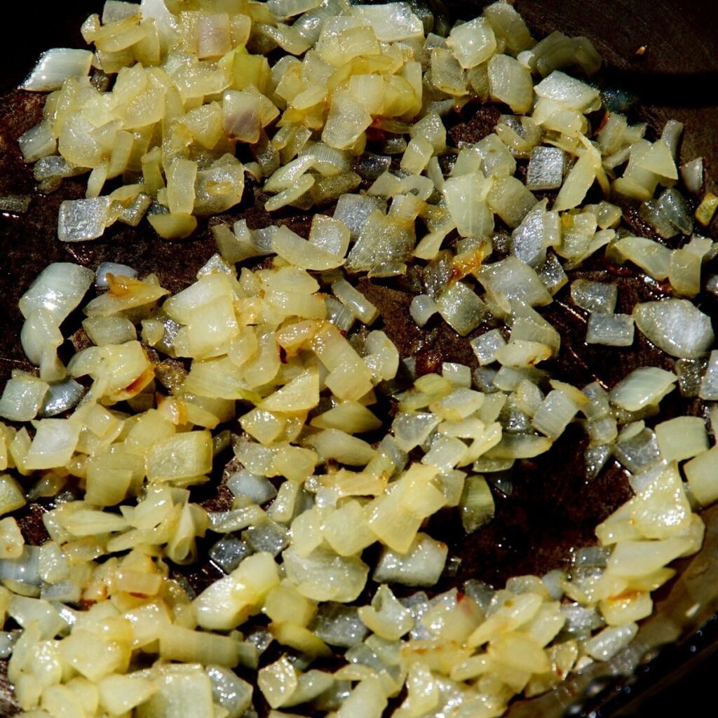 onions cooking in a pan