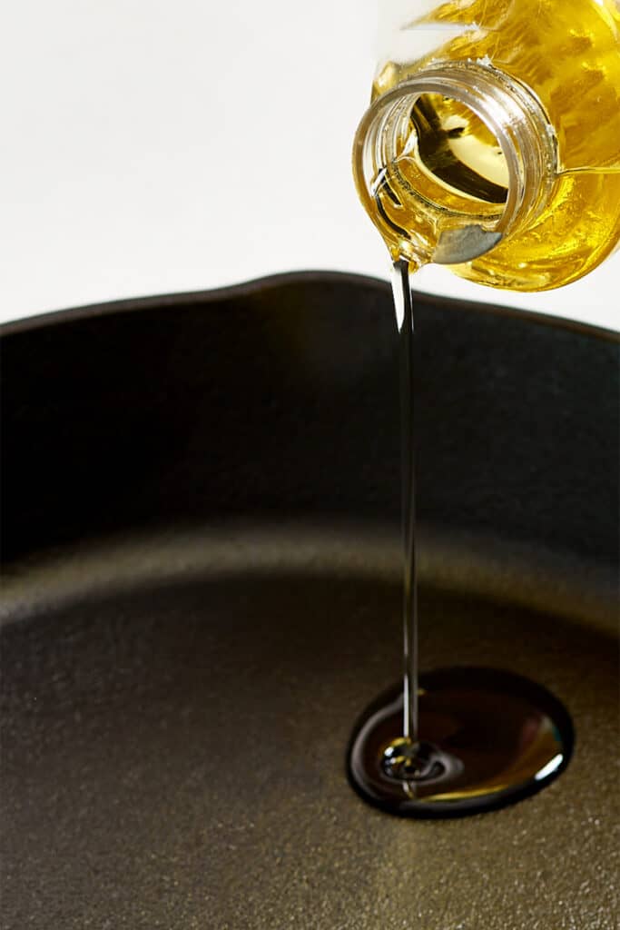 oil being pored into a pan