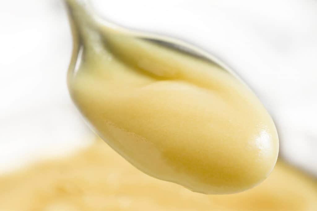 a close up of a spoonful of pastry cream