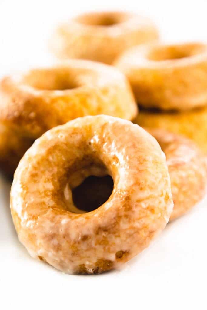 a pile of ring donuts covered in glaze