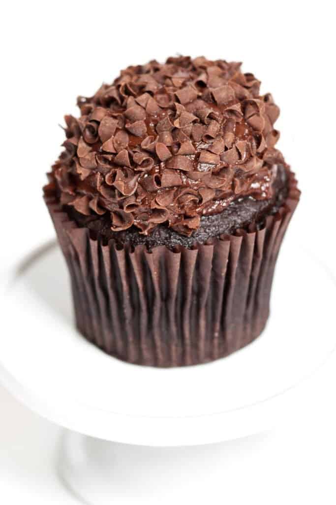 A chocolate cupcake covered in chocolate frosting