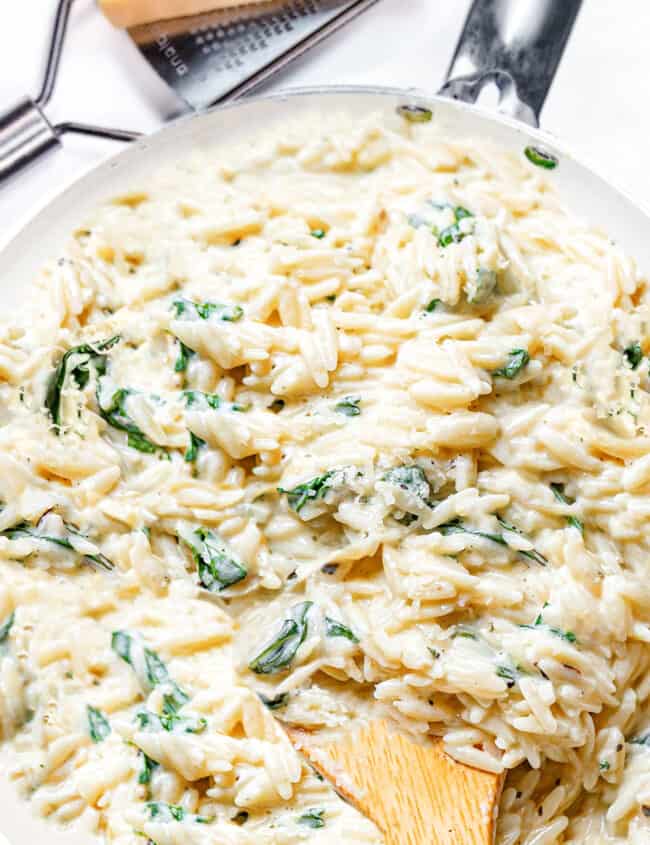 a pot of creamy orzo with spinach