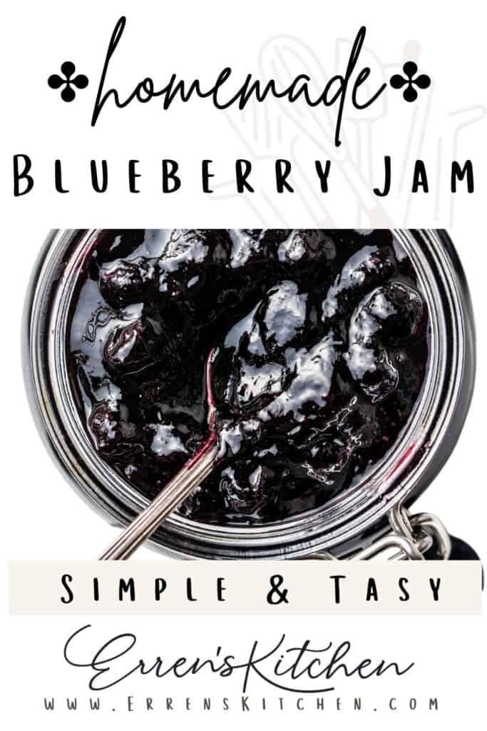 a jar of blueberry jam with a spoon