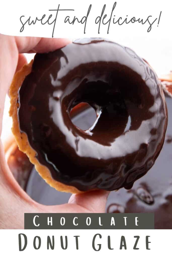 a donut fresly dipped in chocolate glaze