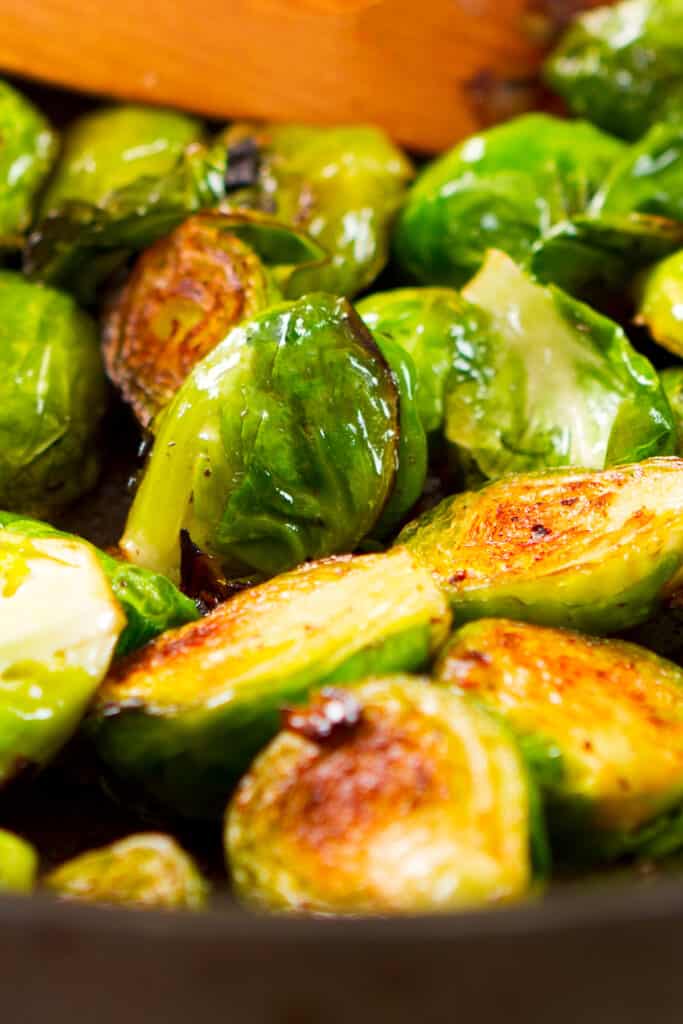 seared Brussels sprounts cooking in a pan