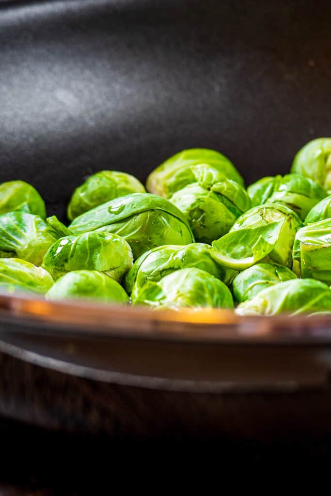 Brussels sprouts in a pan cut side down