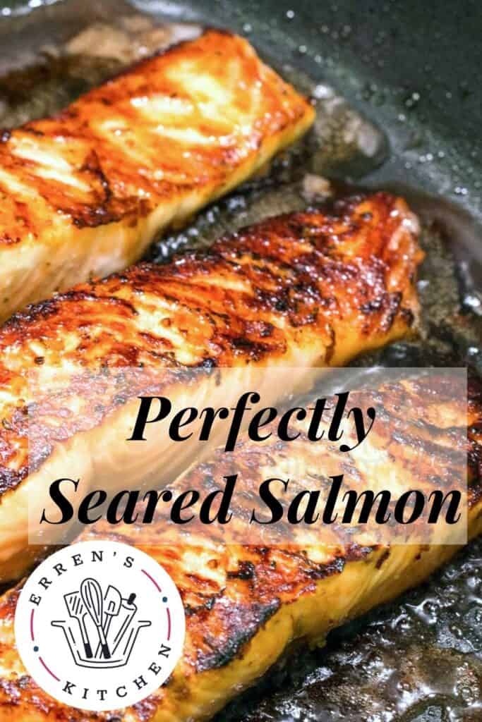 salmon fillets cooking in a pan