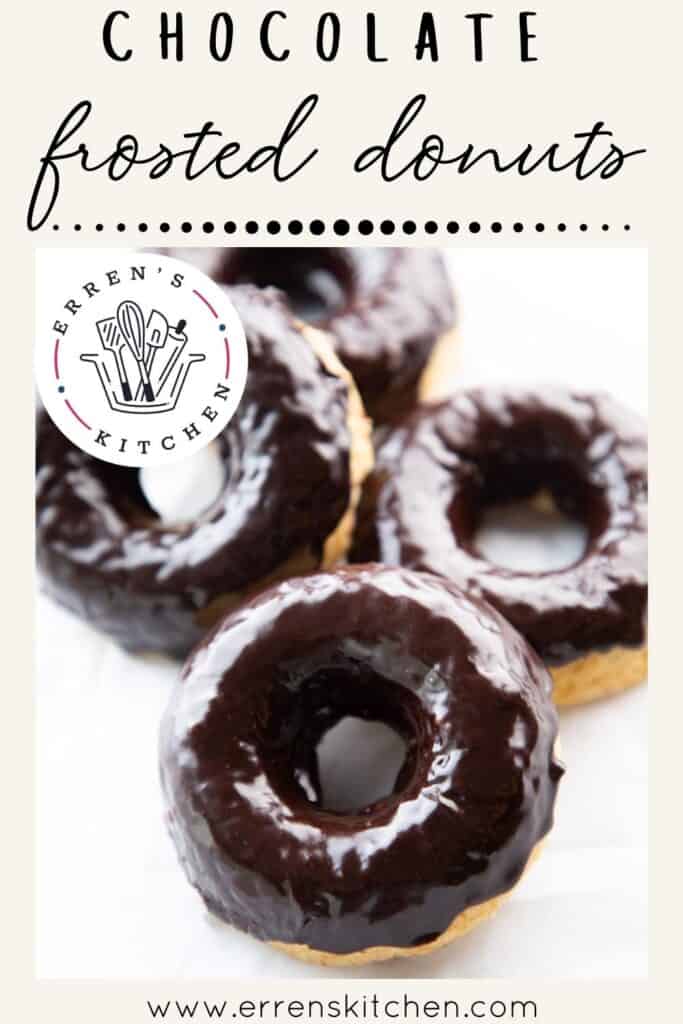 Four Chocolate frosted donuts piled together
