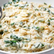 Parmesan Lemon Orzo Pasta in a bowl with a serving spoon.