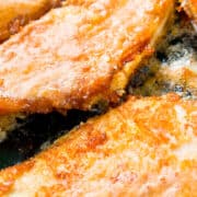 breaded fish frying in a pan