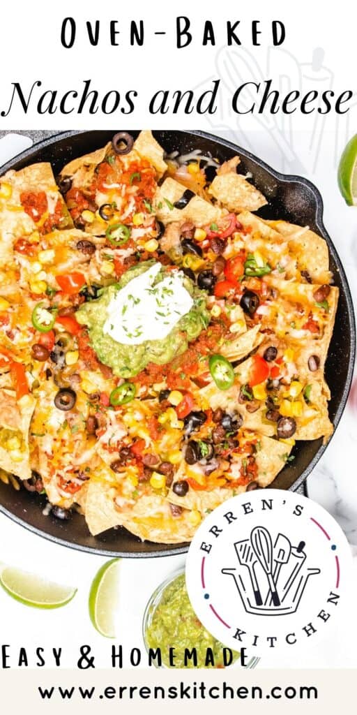 an overhead image of of a cast iron pan with nachos topped with guacamole and sour cream ready to serve