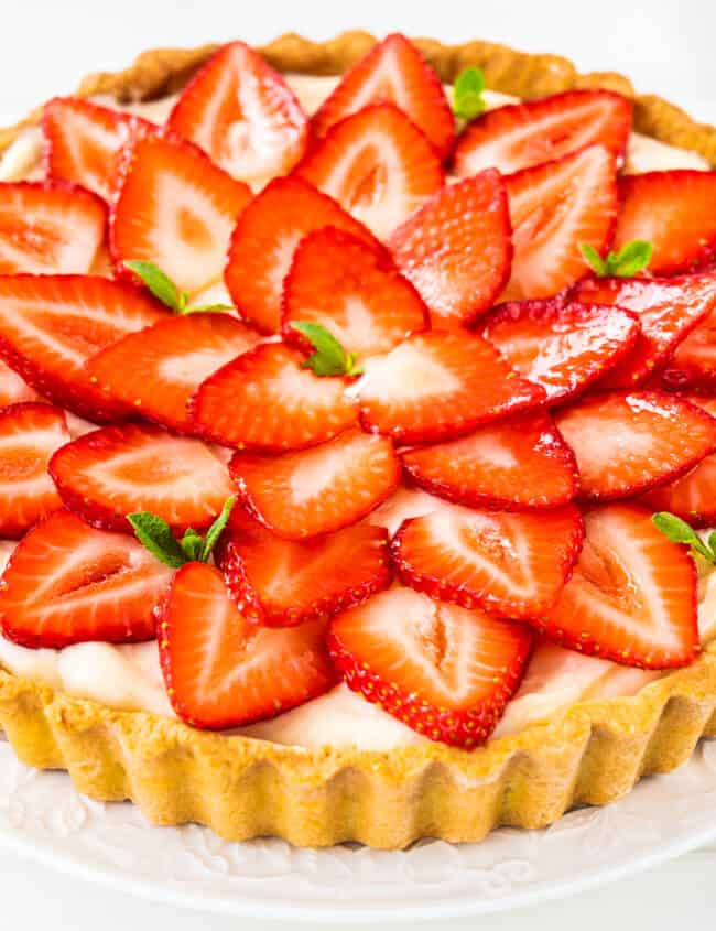 a custard tart topped with strawberries