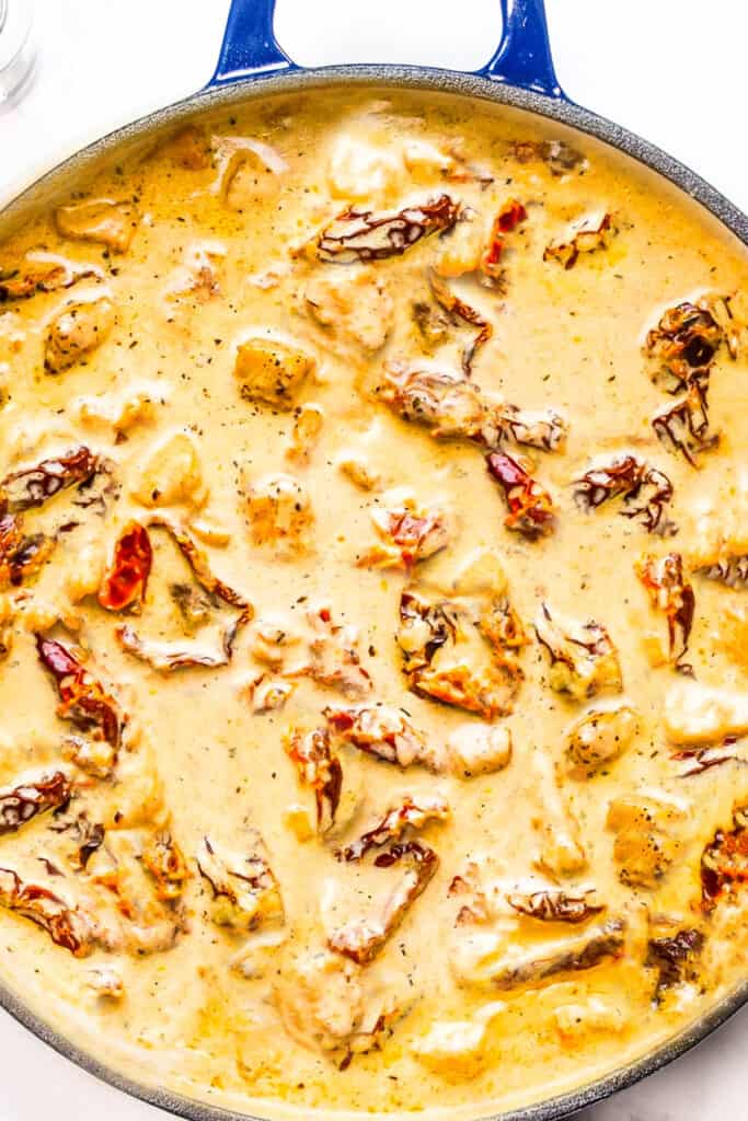 The cream and chicken added to the pan