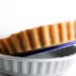 Shortbread Crust being pushed out of a tart pan