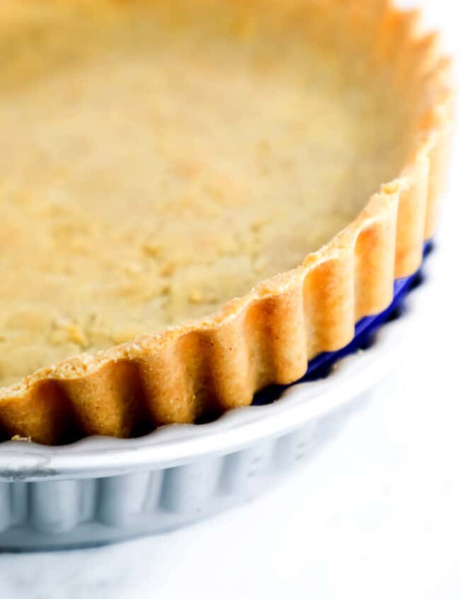 Shortbread Crust {Sablé Breton} being pressed out of the pan