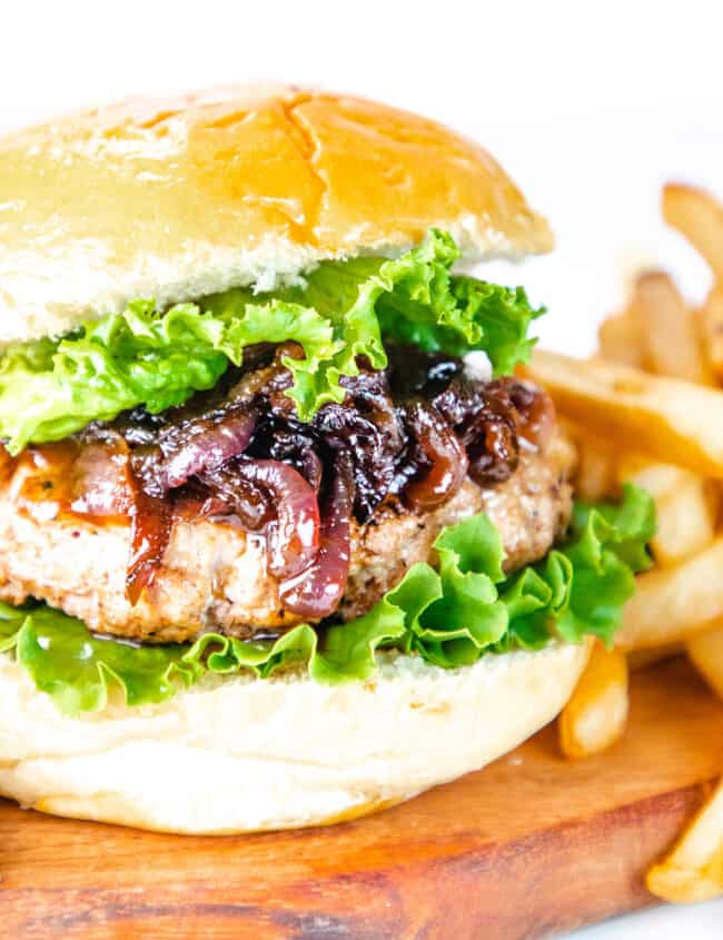 a burger topped with Caramelized Onions