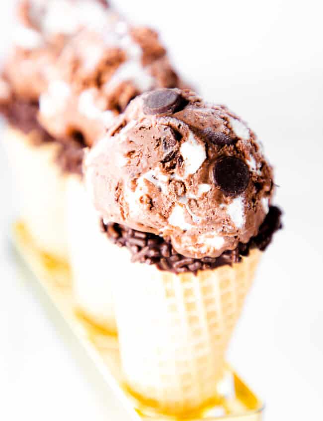 three ice cream cones with scoops of Chocolate Marshmallow Ice Cream