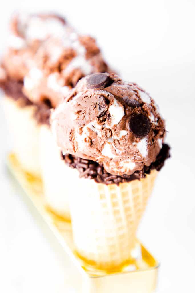 three ice cream cones with scoops of Chocolate Marshmallow Ice Cream