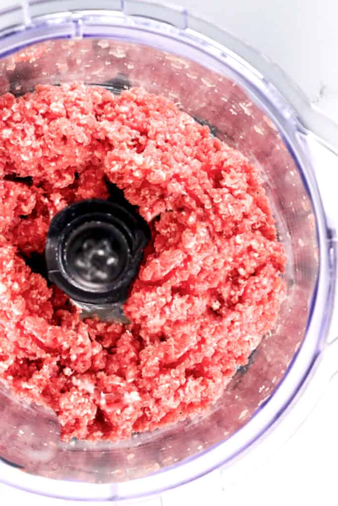 Making your own ground meat for burgers in food processor.