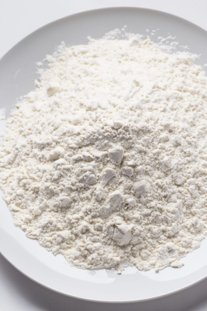 a shallow bowl of seasoned flour.