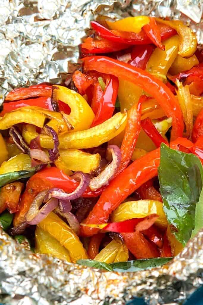 cooked onions and peppers  in foil