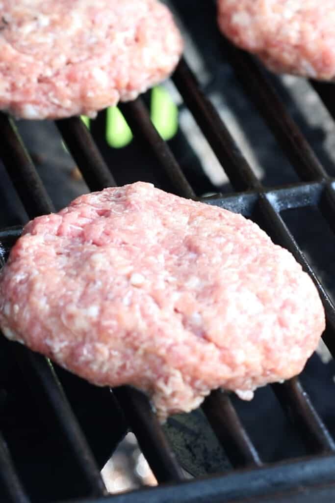 pork patties on a grill