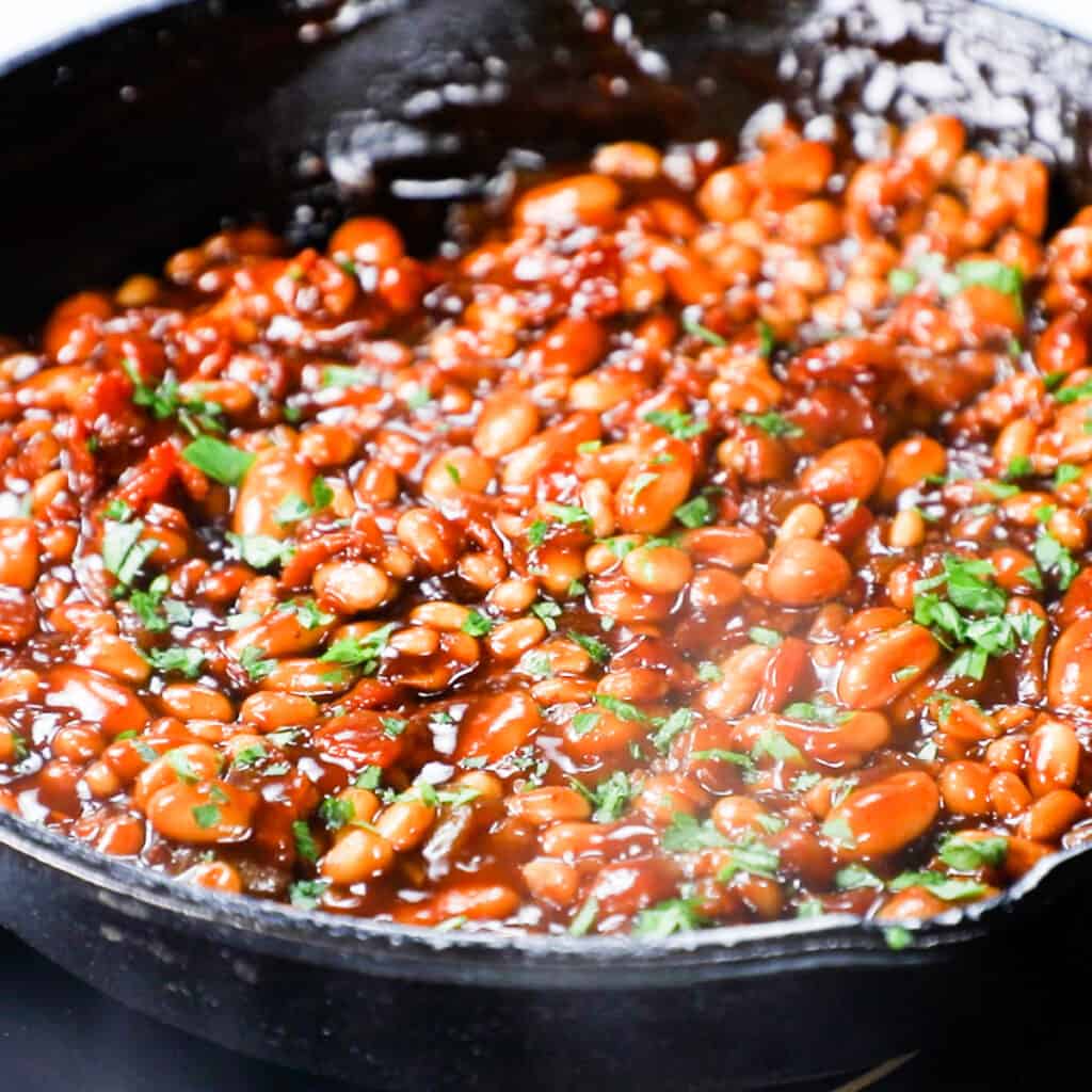 vinegar and parsley added to the Homemade BBQ Baked Beans