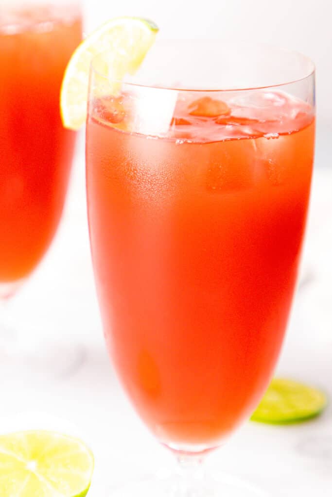 a Bay Breeze covktail garnished with lime