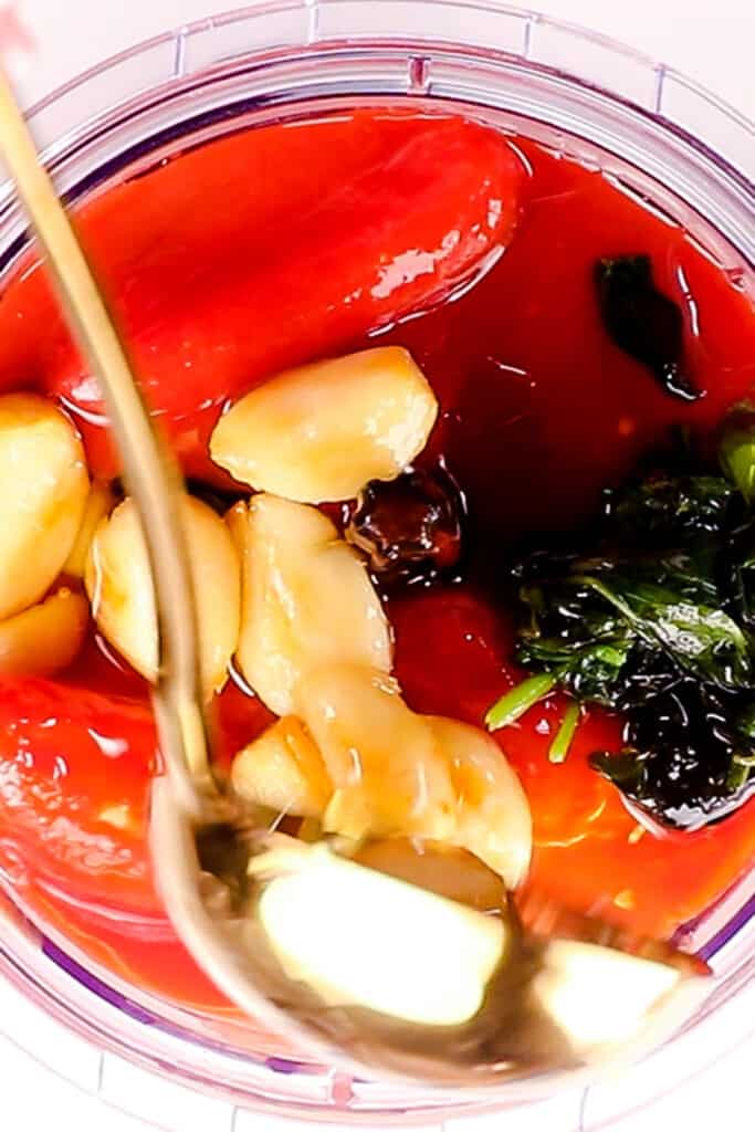 the tomatoes and garlic mixture in a blender