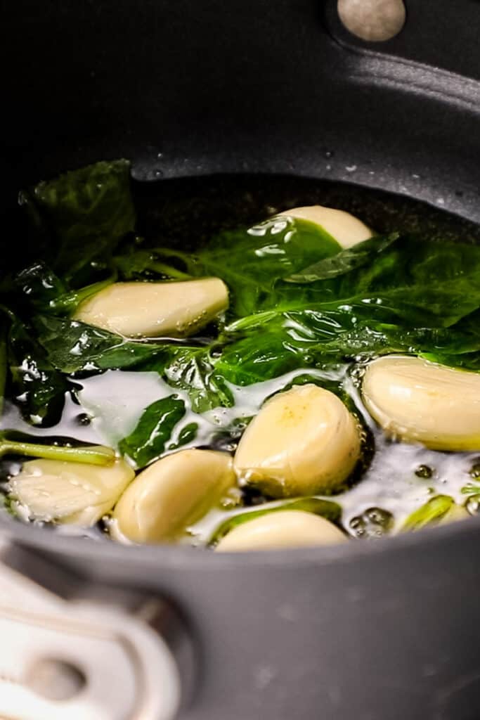 garlic and basil cooking in olive oil