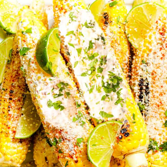 Mexican Street Corn covered in a sour cream sauce and crumbled cheese