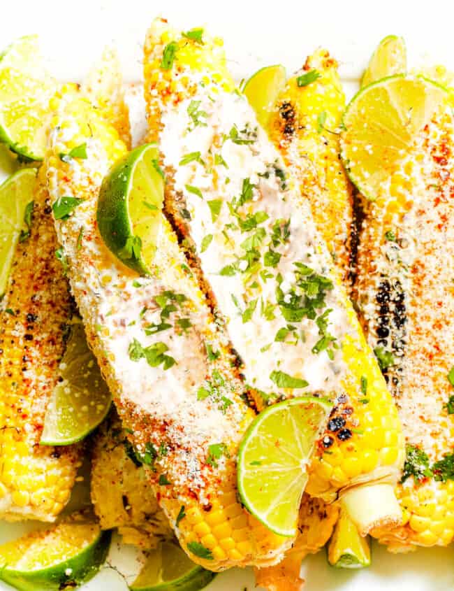 Mexican Street Corn covered in a sour cream sauce and crumbled cheese