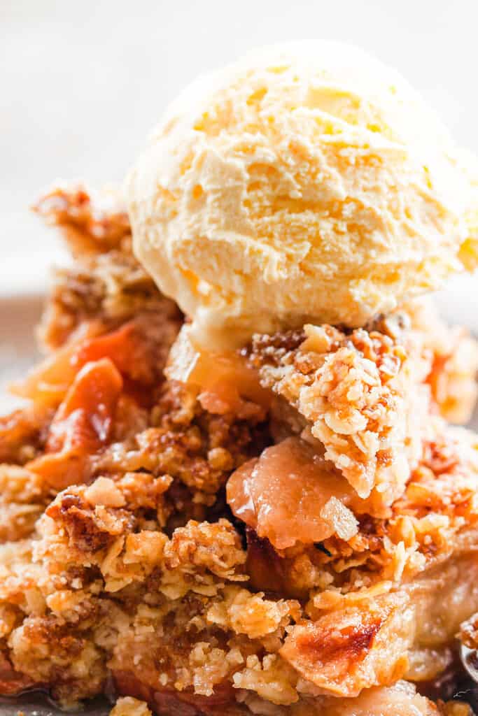 a dish of Oatmeal Apple Crisp with vanilla ice cream on top