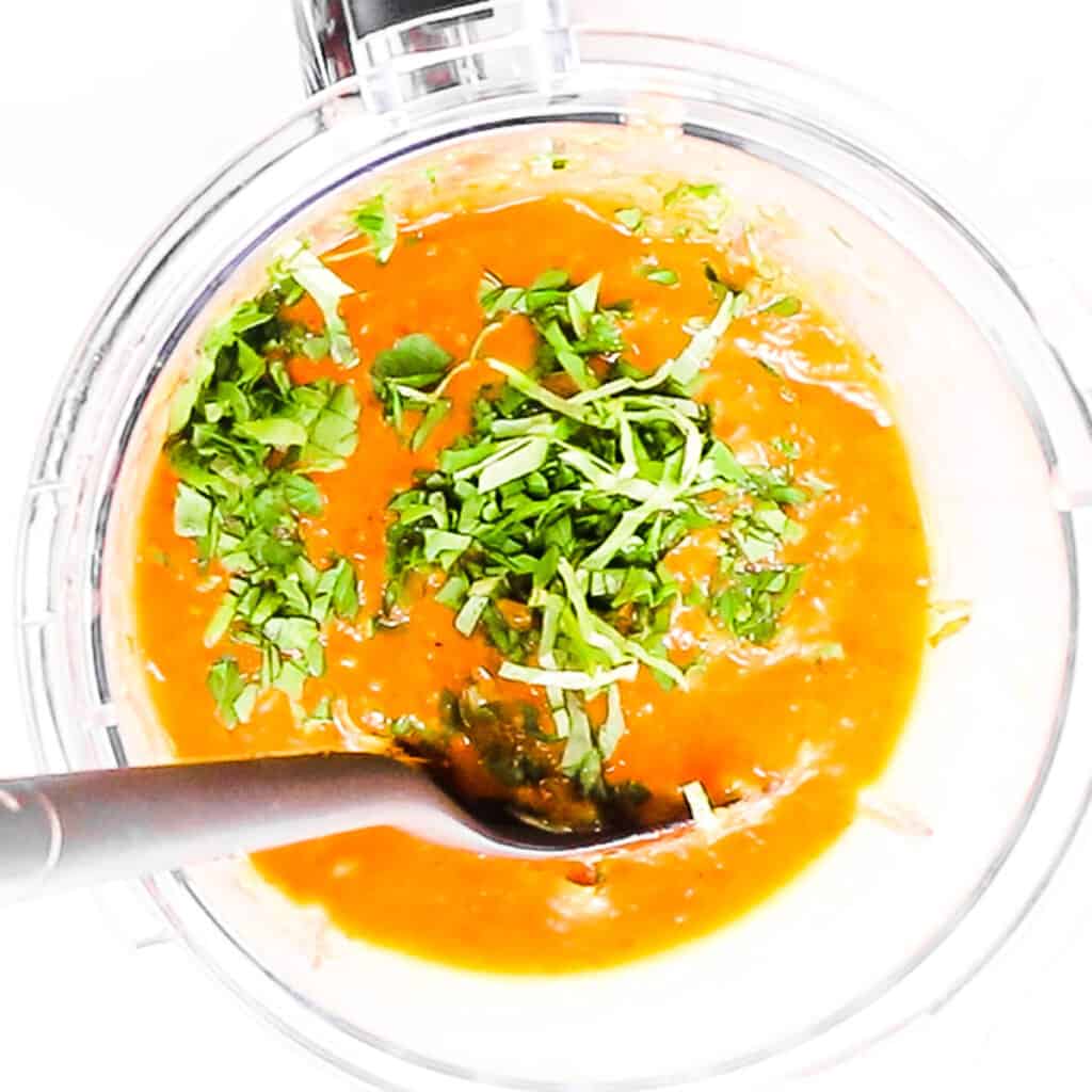 the sauce in a blender with chopped herbs