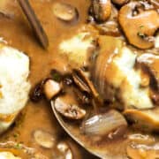 Smothered Pork Chops covered with meltedcheese with mushrooms and onions