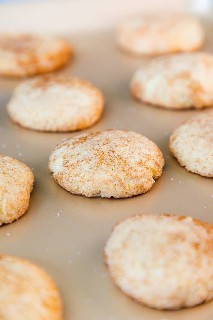 The Best Ever Snickerdoodle Recipe cookies baked on a cookie sheet