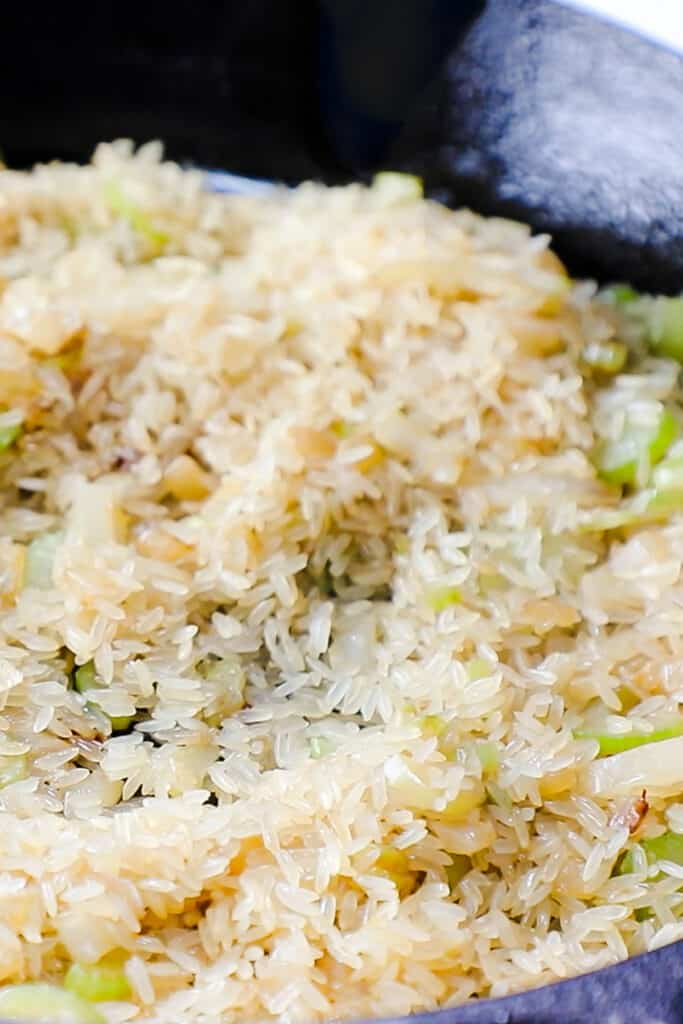 Add the rice in the pan coated with the butter.