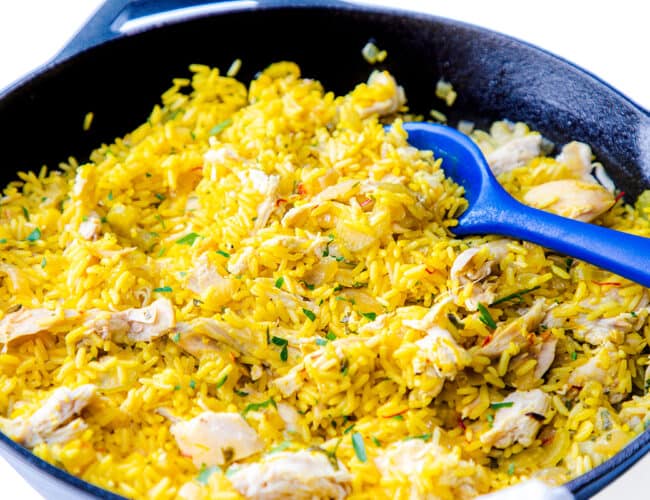 a pan full of Chicken and yellow rice