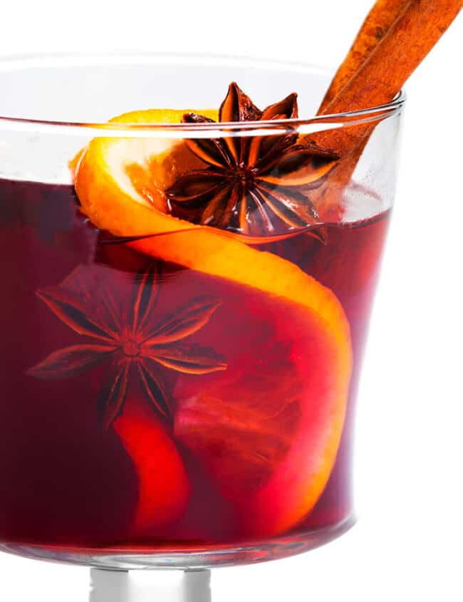 a close up of Cranberry Holiday Cocktail with Vodka with star anise and a cinnamon stick