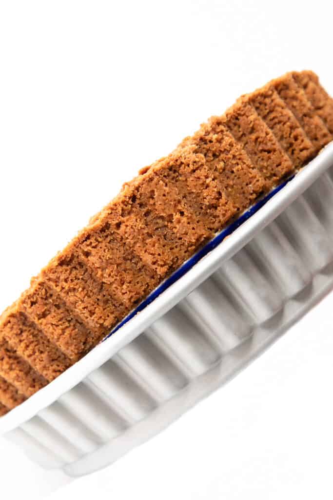 the other edge of a Graham Cracker Crust being pushed from a pan