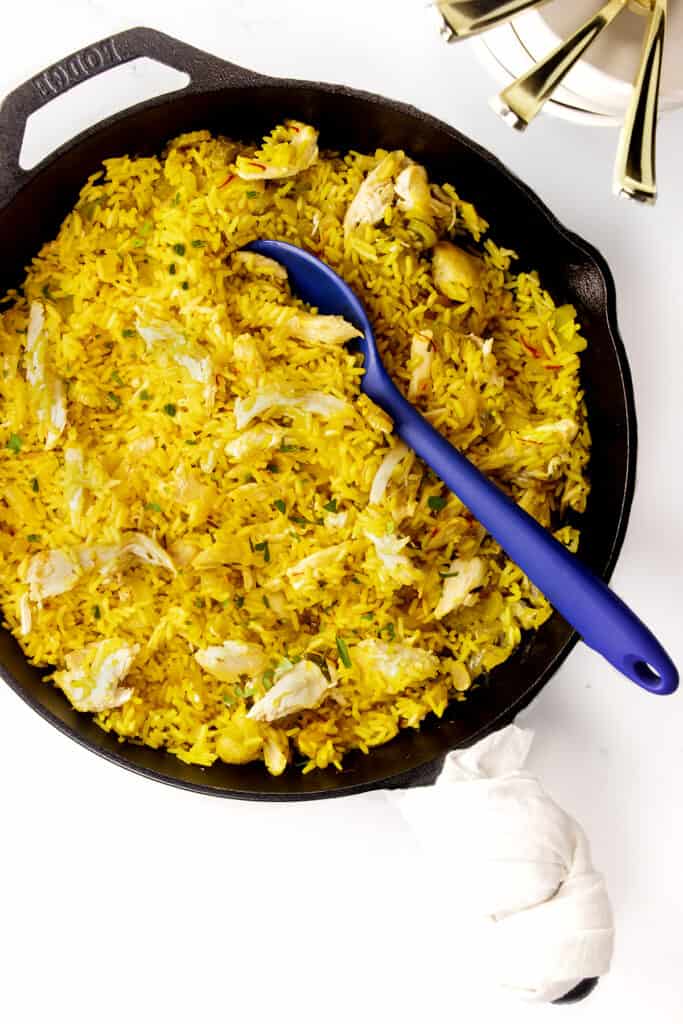 a pan of Chicken and yellow rice taken from above