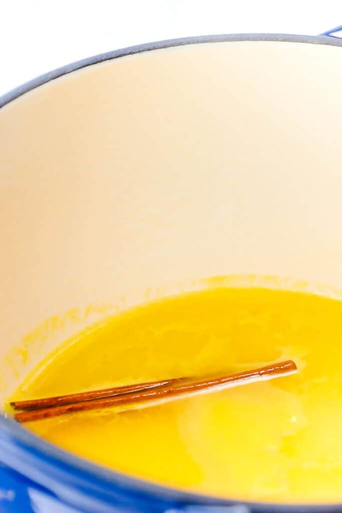 the cinnamon stick in the pot with the water and juice
